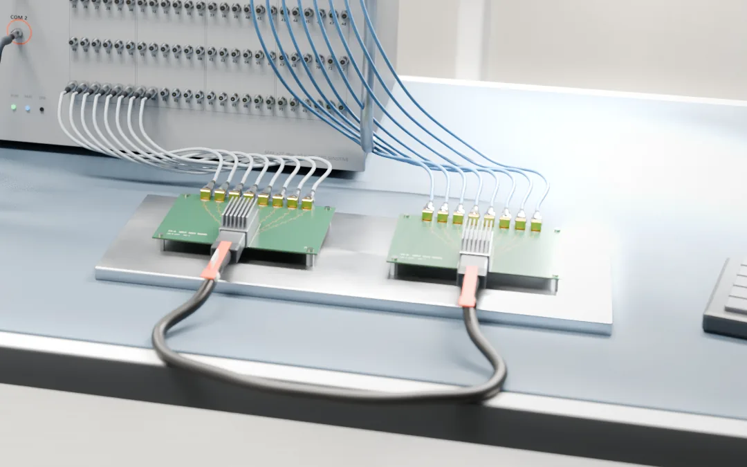A DAC cable plugged into two paddle-card test boards on a fixture plate, with thin coaxial cables running from the boards' edge connectors to a switch matrix